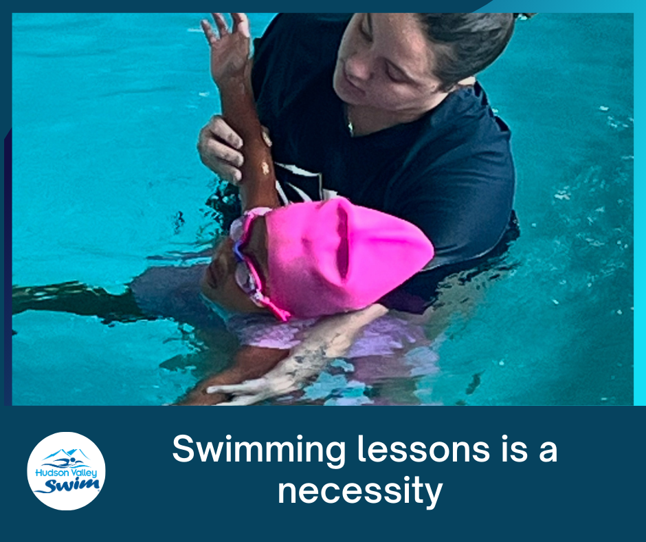 young swim student swimming with instructor