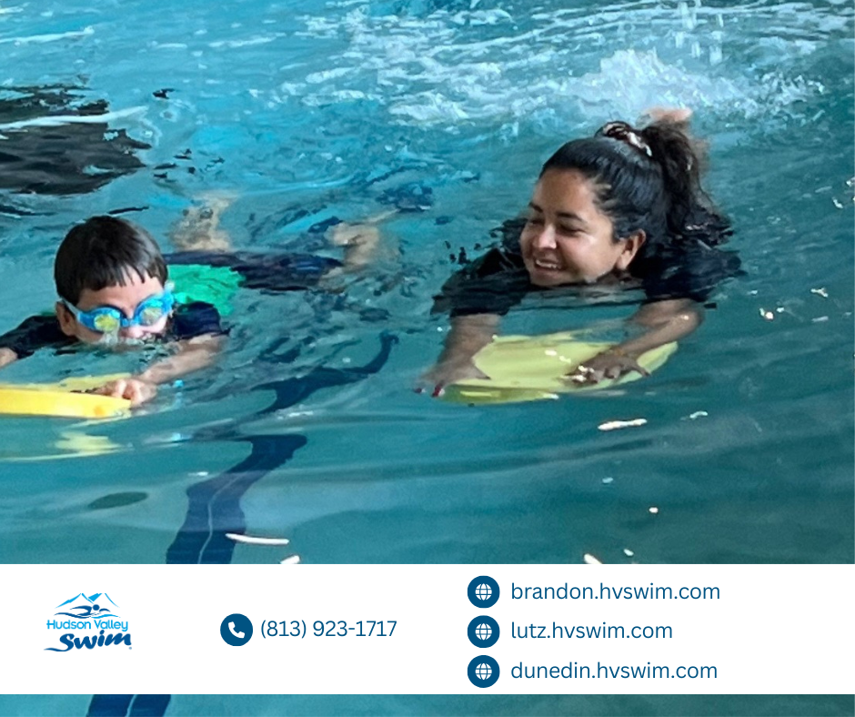 a young boy learning how to swim on a boogie board with his swim teacher in a pool
